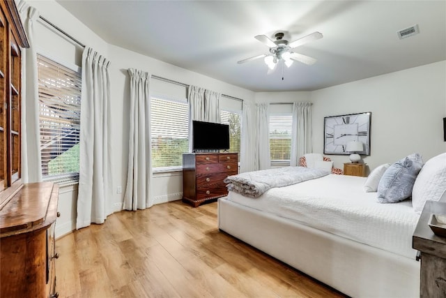 1307 Osprey Ridge Loop, Lago Vista, TX 78645 - bedroom with light wood-style floors and ceiling fan