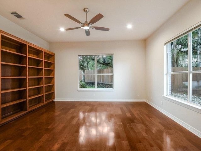 1624 Cabinwood Cv, Austin, TX 78746 - spare room featuring wood finished floors, a ceiling fan, and recessed lighting