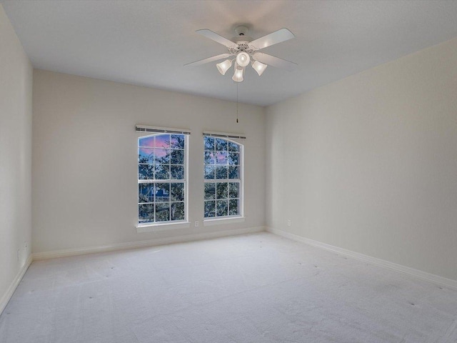 1624 Cabinwood Cv, Austin, TX 78746 - carpeted spare room featuring baseboards and a ceiling fan