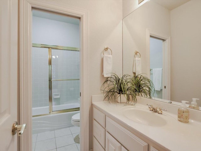 1624 Cabinwood Cv, Austin, TX 78746 - bathroom with vanity, bath / shower combo with glass door, and tile patterned floors
