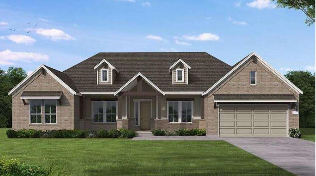 376 Double Eagle Ranch Dr, Cedar Creek, TX 78612 - view of front of house featuring driveway, brick siding, a front lawn, and a garage