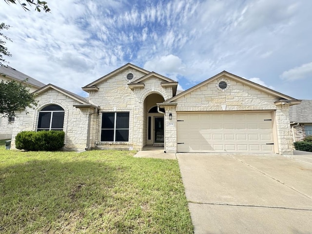 219 Memory Ln, Harker Heights, TX 76548 - french country inspired facade with driveway, a front lawn, stone siding, and an attached garage