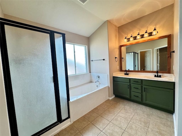 219 Memory Ln, Harker Heights, TX 76548 - bathroom featuring vaulted ceiling, a garden tub, double vanity, a shower stall, and tile patterned floors