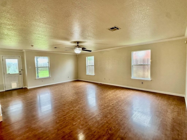 3303 Solomon Dr, Killeen, TX 76542 - unfurnished room featuring crown molding, dark wood-type flooring, a textured ceiling, and ceiling fan