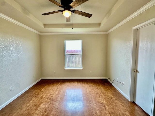 3303 Solomon Dr, Killeen, TX 76542 - spare room with a tray ceiling, wood finished floors, ceiling fan, and a textured wall
