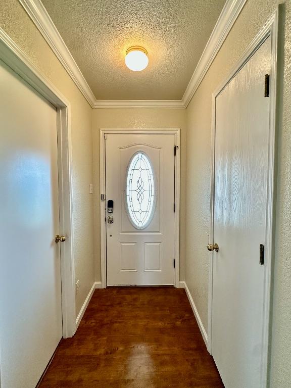 3303 Solomon Dr, Killeen, TX 76542 - doorway to outside featuring a textured ceiling, wood finished floors, and ornamental molding