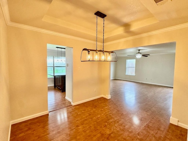 3303 Solomon Dr, Killeen, TX 76542 - unfurnished dining area featuring a raised ceiling, dark wood-style floors, ceiling fan, and ornamental molding