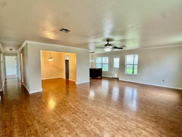 3303 Solomon Dr, Killeen, TX 76542 - unfurnished living room with ornamental molding, wood finished floors, a textured ceiling, and a ceiling fan