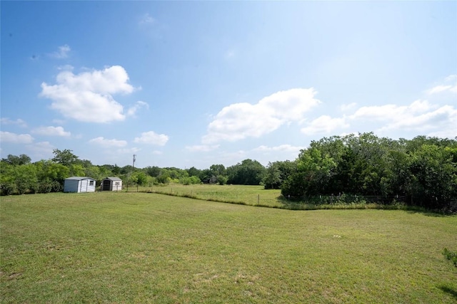 194 Rabbit Trl, Dale, TX 78616 - view of yard with a storage shed and a view of rural / pastoral area