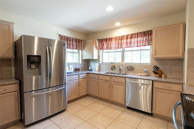 194 Rabbit Trl, Dale, TX 78616 - kitchen with appliances with stainless steel finishes, light brown cabinets, decorative backsplash, light countertops, and recessed lighting