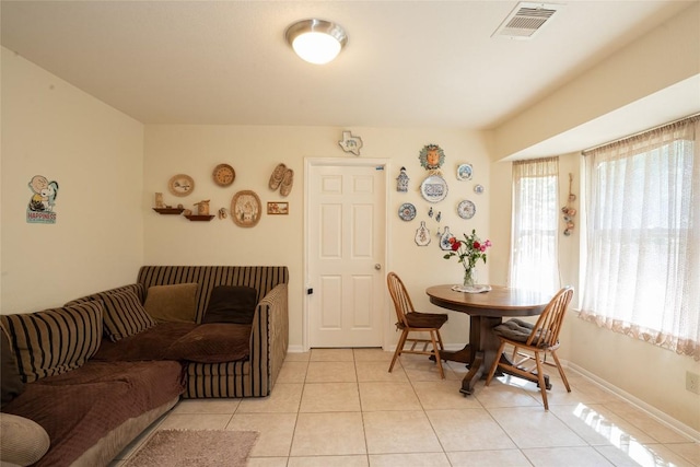 194 Rabbit Trl, Dale, TX 78616 - dining room featuring light tile patterned flooring and baseboards