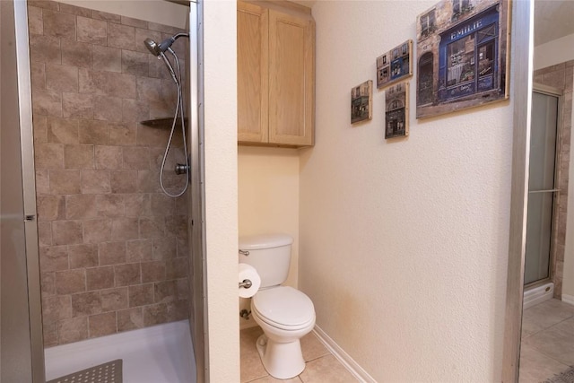 194 Rabbit Trl, Dale, TX 78616 - bathroom featuring tile patterned flooring and a stall shower