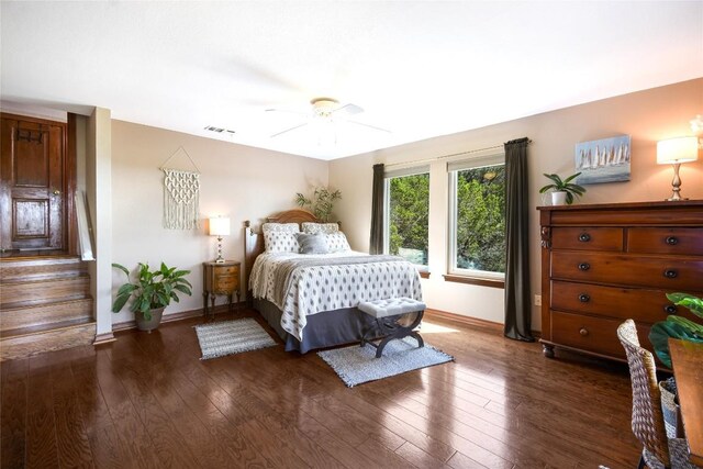 21013 Fawn Ridge Dr, Lago Vista, TX 78645 - bedroom with dark wood finished floors and ceiling fan