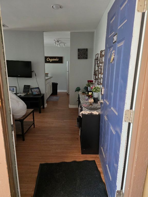 2124 Burton Dr Unit 208, Austin, TX 78741 - entrance foyer with wood finished floors and baseboards