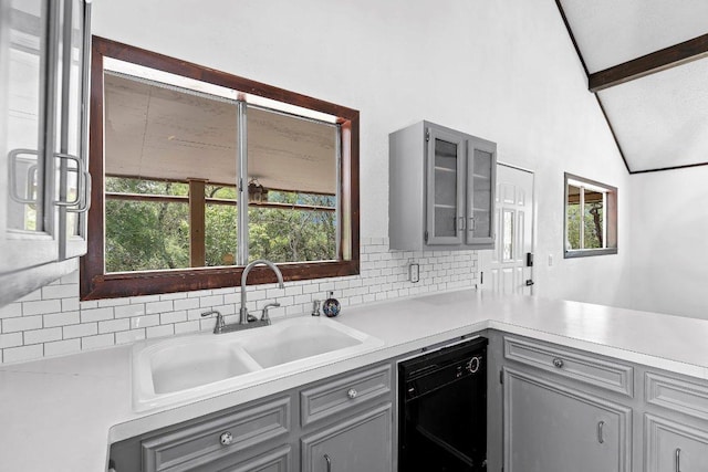 130 Anderson Ln, Red Rock, TX 78662 - kitchen featuring gray cabinets, dishwasher, and tasteful backsplash