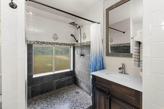 130 Anderson Ln, Red Rock, TX 78662 - bathroom with tile walls, a tile shower, and vanity