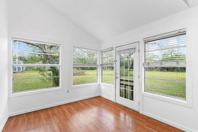 130 Anderson Ln, Red Rock, TX 78662 - unfurnished sunroom with wood finished floors, plenty of natural light, and vaulted ceiling