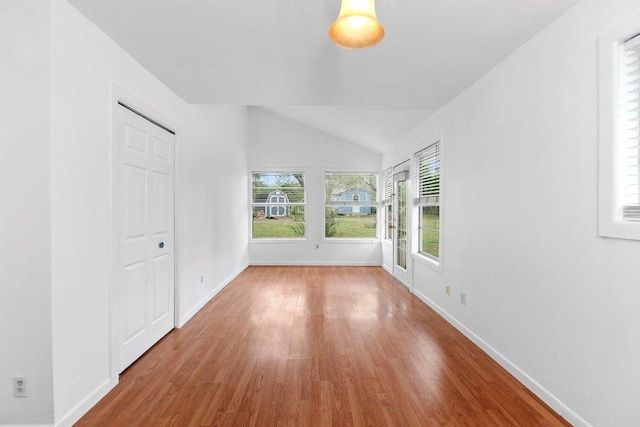 130 Anderson Ln, Red Rock, TX 78662 - unfurnished room featuring wood finished floors and lofted ceiling