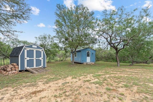 130 Anderson Ln, Red Rock, TX 78662 - view of grassy yard featuring a shed