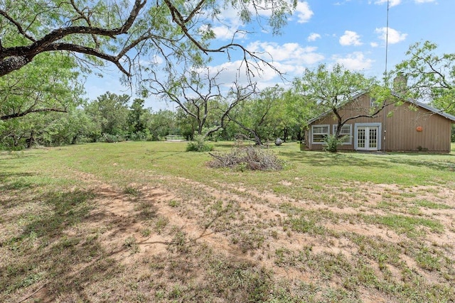 130 Anderson Ln, Red Rock, TX 78662 - view of grassy yard with french doors