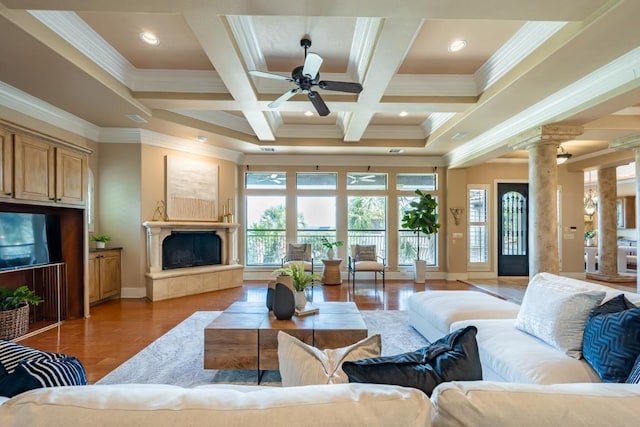 5120 Mansfield View Ct, Austin, TX 78732 - living area featuring crown molding, decorative columns, light wood-style floors, beam ceiling, and ceiling fan