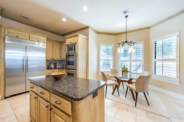 5120 Mansfield View Ct, Austin, TX 78732 - kitchen featuring built in appliances, crown molding, light brown cabinetry, plenty of natural light, and a chandelier