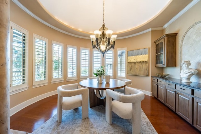 5120 Mansfield View Ct, Austin, TX 78732 - dining area featuring a chandelier, plenty of natural light, a tray ceiling, dark wood finished floors, and crown molding