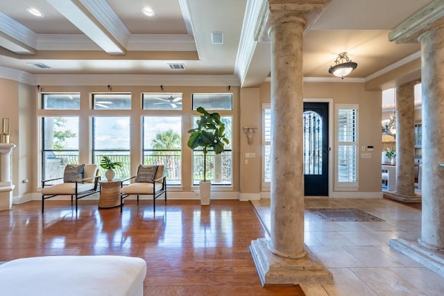 5120 Mansfield View Ct, Austin, TX 78732 - entrance foyer featuring decorative columns, ornamental molding, plenty of natural light, a ceiling fan, and wood finished floors