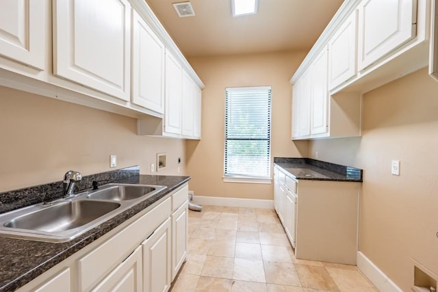 5120 Mansfield View Ct, Austin, TX 78732 - kitchen featuring white cabinets and light tile patterned floors