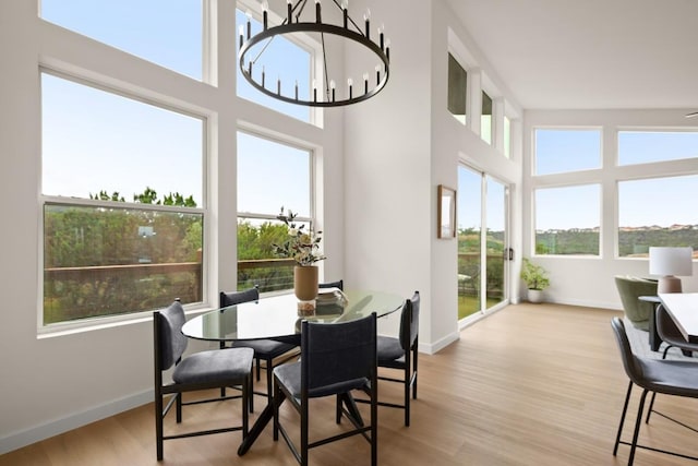 1817 High Lonesome, Leander, TX 78641 - dining space featuring light wood-style flooring and a high ceiling