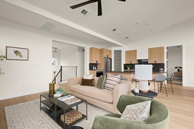 1817 High Lonesome, Leander, TX 78641 - living area with a ceiling fan, light wood-type flooring, and lofted ceiling