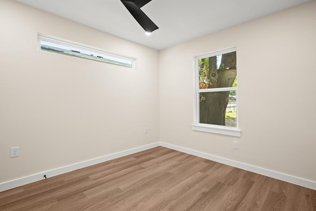 3704 Munson St Unit 1, Austin, TX 78721 - empty room featuring wood finished floors and ceiling fan