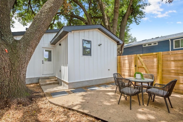 3704 Munson St Unit 1, Austin, TX 78721 - view of outdoor structure featuring outdoor dining area and entry steps