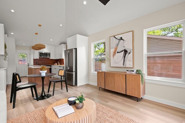3704 Munson St Unit 1, Austin, TX 78721 - living room with plenty of natural light, light wood-style floors, recessed lighting, and vaulted ceiling