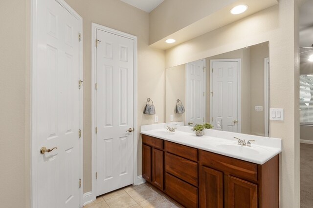 15325 Interlachen Dr, Austin, TX 78717 - bathroom featuring double vanity, tile patterned floors, and recessed lighting