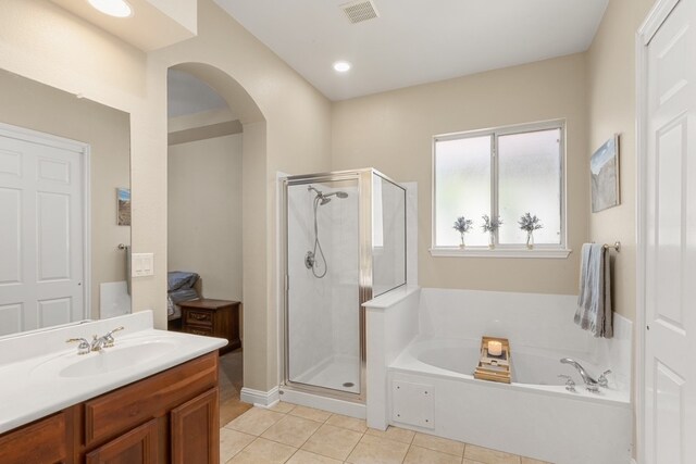 15325 Interlachen Dr, Austin, TX 78717 - bathroom with tile patterned flooring, a shower stall, a bath, and vanity