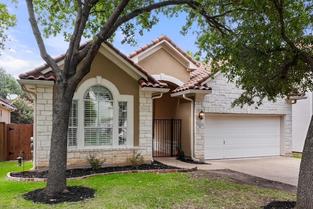 15325 Interlachen Dr, Austin, TX 78717 - view of front facade featuring stone siding, a tile roof, concrete driveway, stucco siding, and a garage