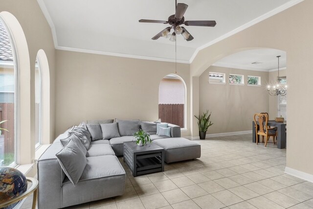 15325 Interlachen Dr, Austin, TX 78717 - living room featuring crown molding, light tile patterned floors, a ceiling fan, arched walkways, and a chandelier