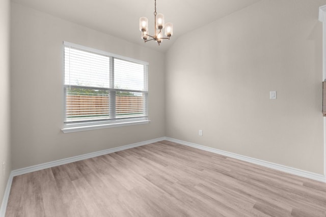 817 Coke Rd, Burnet, TX 78611 - unfurnished room featuring light wood-type flooring, a chandelier, and lofted ceiling
