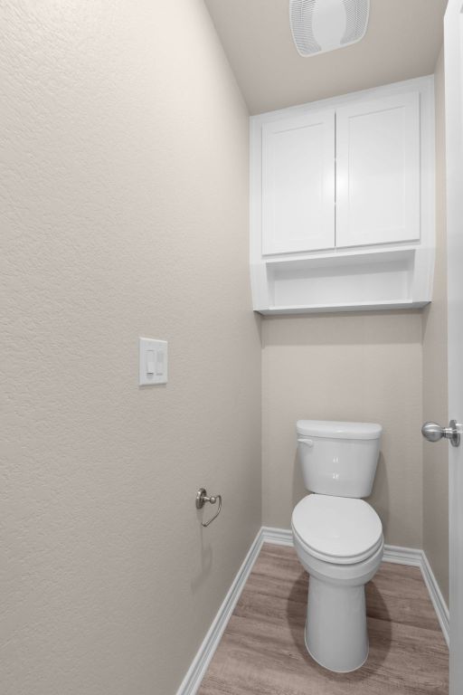 817 Coke Rd, Burnet, TX 78611 - bathroom featuring wood finished floors and baseboards