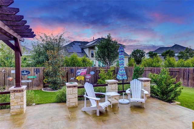 2817 Mossy Springs Dr, Leander, TX 78641 - patio terrace at dusk with a patio area and a fenced backyard