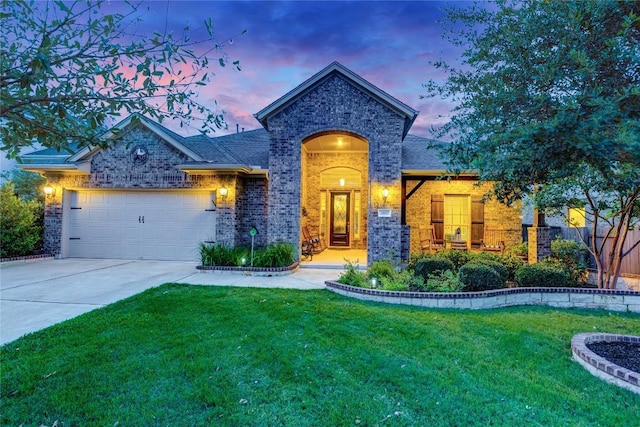 2817 Mossy Springs Dr, Leander, TX 78641 - view of front of house with brick siding, a garage, driveway, and roof with shingles