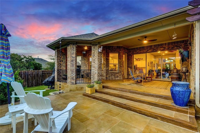 2817 Mossy Springs Dr, Leander, TX 78641 - patio terrace at dusk featuring a patio area