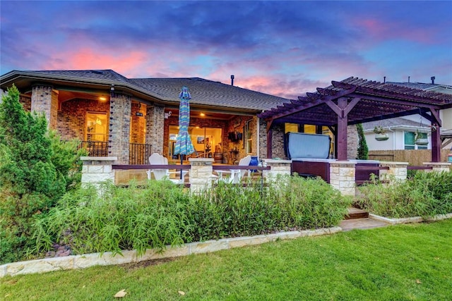2817 Mossy Springs Dr, Leander, TX 78641 - back of house at dusk with brick siding and a pergola