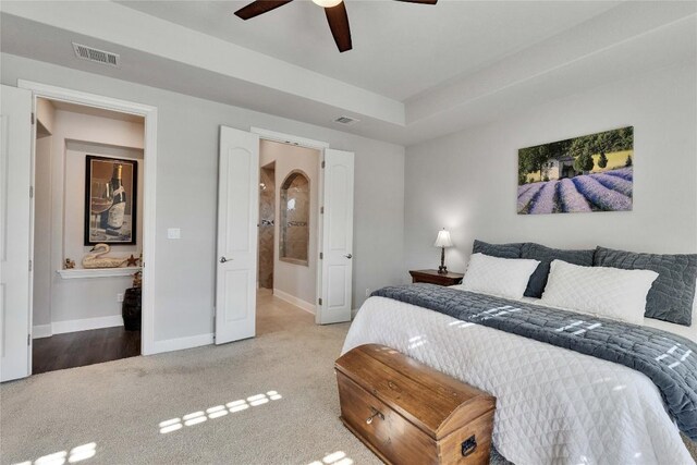 2817 Mossy Springs Dr, Leander, TX 78641 - carpeted bedroom featuring ensuite bathroom and ceiling fan