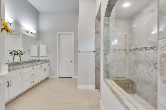 2817 Mossy Springs Dr, Leander, TX 78641 - bathroom with vanity, a tile shower, and tile patterned floors