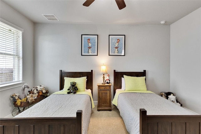 2817 Mossy Springs Dr, Leander, TX 78641 - bedroom with light colored carpet, multiple windows, and ceiling fan