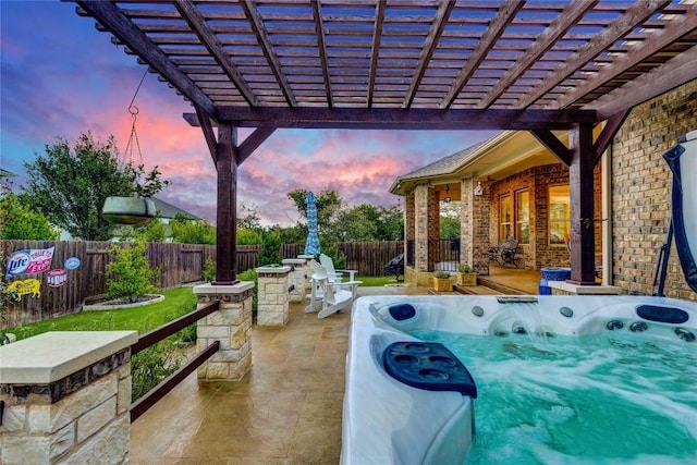 2817 Mossy Springs Dr, Leander, TX 78641 - patio terrace at dusk featuring a hot tub, a fenced backyard, a patio area, and a pergola