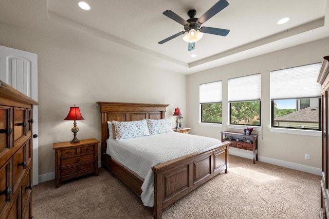 29 Prestonwood Cir, Lakeway, TX 78734 - bedroom with light carpet, a tray ceiling, recessed lighting, and a ceiling fan