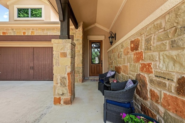 29 Prestonwood Cir, Lakeway, TX 78734 - doorway to property with stone siding, concrete driveway, and an attached garage
